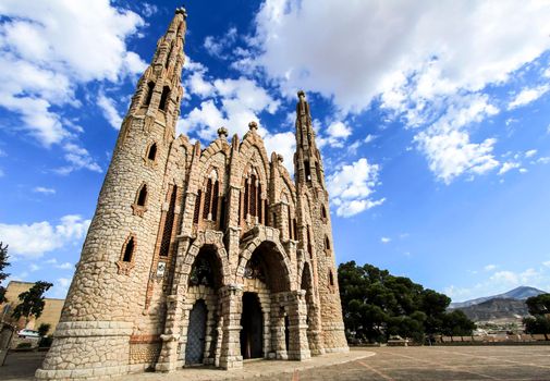 Novelda, Alicante, Spain- September 24, 2021: Details, archs, tower and pictures of Sanctuary of Santa Maria Magdalena on the top of the mountain in Novelda, Alicante, Spain.