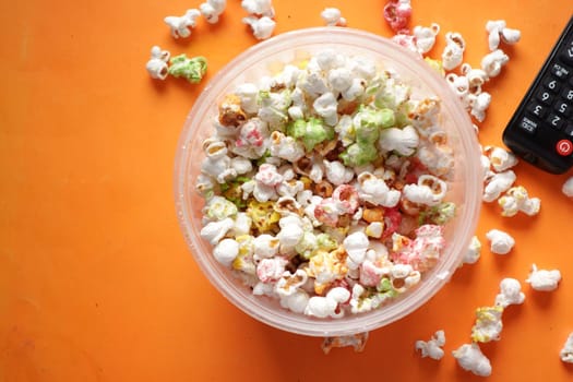 high angle view of popcorn spilling from container .