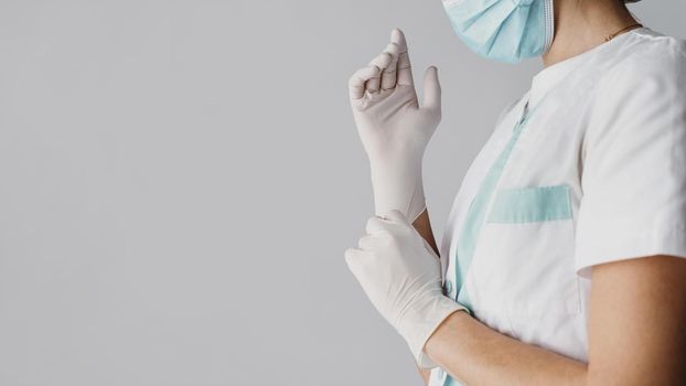 doctor putting surgical gloves with copy space. Resolution and high quality beautiful photo
