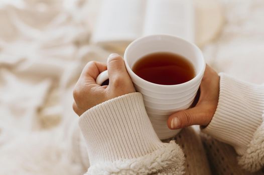young woman holding cup tea while enjoying winter holidays. Resolution and high quality beautiful photo