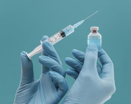 vaccine bottle syringe held by doctor with gloves. Resolution and high quality beautiful photo