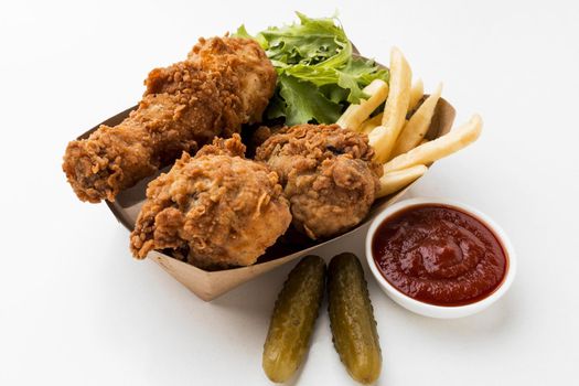 high angle fried chicken drumsticks with ketchup fries. Resolution and high quality beautiful photo