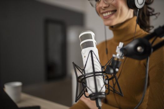 woman broadcasting radio while smiling. Resolution and high quality beautiful photo