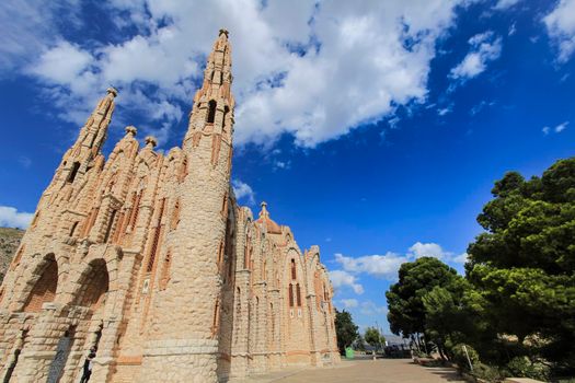 Novelda, Alicante, Spain- September 24, 2021: Details, archs, tower and pictures of Sanctuary of Santa Maria Magdalena on the top of the mountain in Novelda, Alicante, Spain.