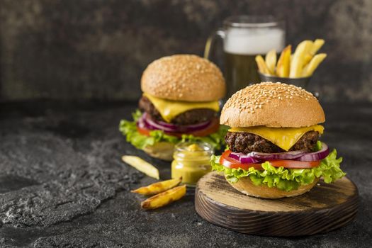 high angle burgers with fries sauce beer with copy space. Resolution and high quality beautiful photo