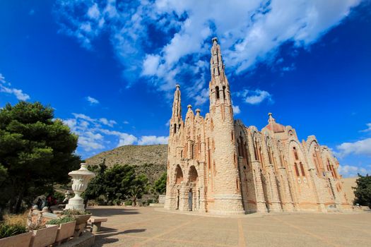 Novelda, Alicante, Spain- September 24, 2021: Details, archs, tower and pictures of Sanctuary of Santa Maria Magdalena on the top of the mountain in Novelda, Alicante, Spain.