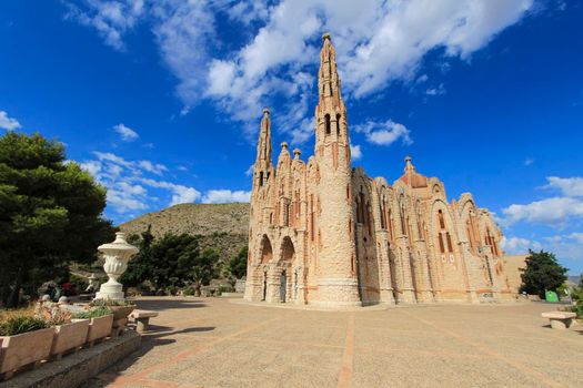 Novelda, Alicante, Spain- September 24, 2021: Details, archs, tower and pictures of Sanctuary of Santa Maria Magdalena on the top of the mountain in Novelda, Alicante, Spain.