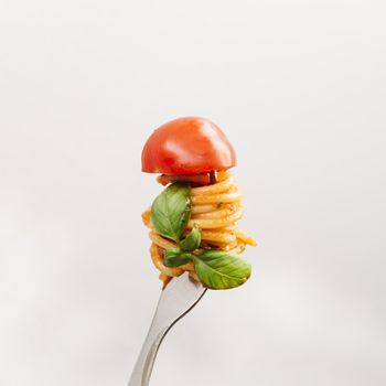 tasty spaghetti wrapped around fork. Resolution and high quality beautiful photo