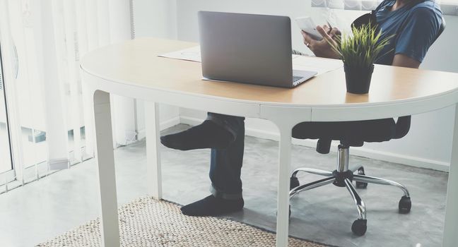 Business man in having a video call on laptop while discussion with business partner during work from home