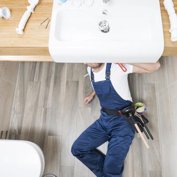 sanitary technician lying sink. Resolution and high quality beautiful photo