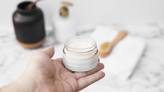 human hand holding jar moisturizing cream. Resolution and high quality beautiful photo