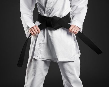 karate fighter proudly holding black belt. Resolution and high quality beautiful photo