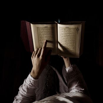 silhouette woman reading quran. Resolution and high quality beautiful photo