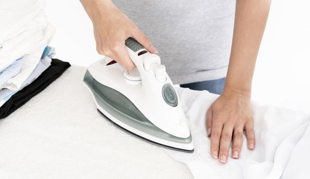 unrecognisable lady ironing clothes. Resolution and high quality beautiful photo