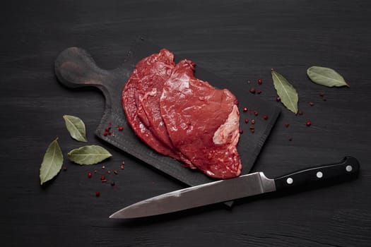 fresh uncooked meat wooden board with knife. Resolution and high quality beautiful photo