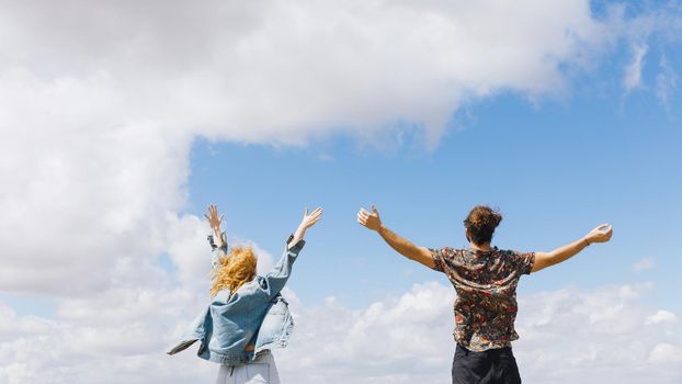 excited couple with hands up. Resolution and high quality beautiful photo