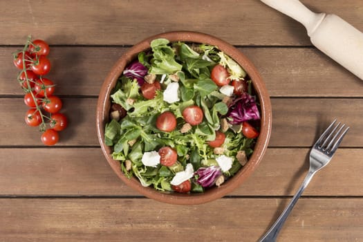 top view wooden surface with delicious salad. Resolution and high quality beautiful photo