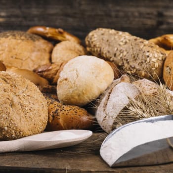 flour with baked whole grain breads table. Resolution and high quality beautiful photo