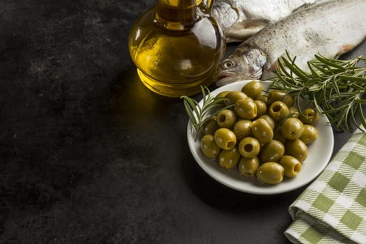 fish olive oil olives dark surface. Resolution and high quality beautiful photo