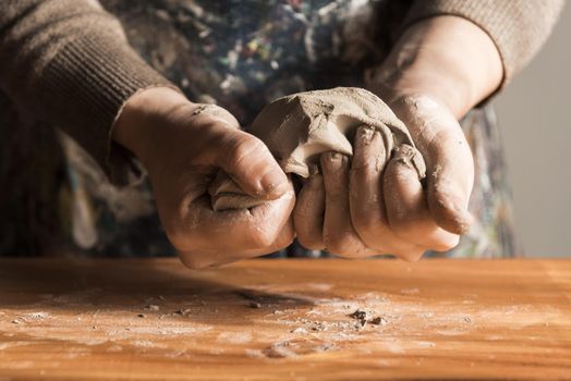 front view woman shaping clay. Resolution and high quality beautiful photo