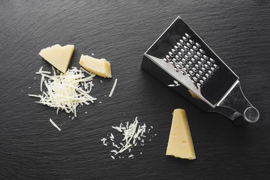 flat lay grated parmesan with grater. Resolution and high quality beautiful photo