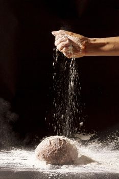 hand pours flour baked bread. Resolution and high quality beautiful photo