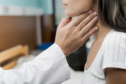 hand touching throat patient. Resolution and high quality beautiful photo