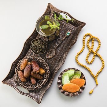 tea glass with dates fruit beads tray. Resolution and high quality beautiful photo