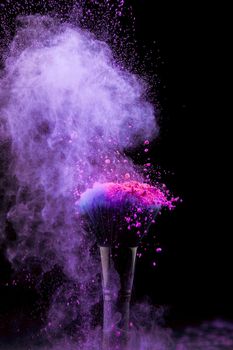 vibrant burst makeup powder with brush dark background. Resolution and high quality beautiful photo