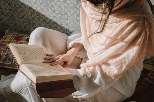 sitting woman reading quran. Resolution and high quality beautiful photo