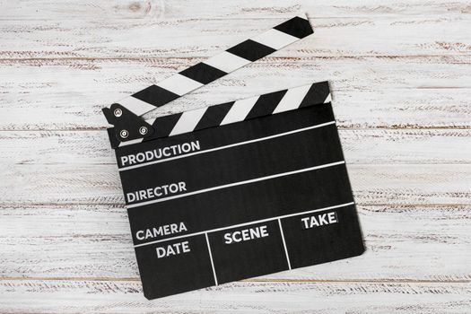 elevated view clapperboard white wooden desk. Resolution and high quality beautiful photo