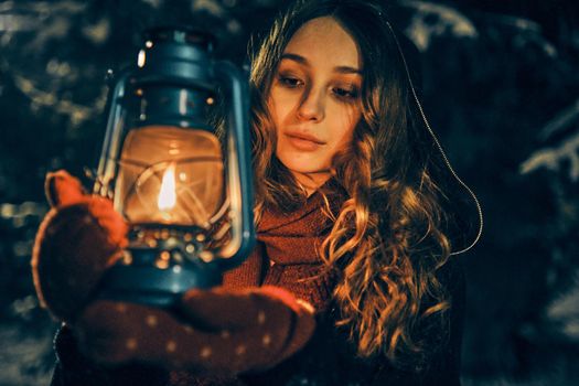 Young girl with lantern in winter forest fairy tale, book cover, christmas time