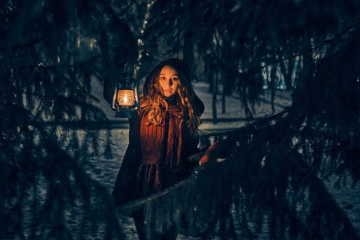 Young girl with lantern in winter forest fairy tale, book cover, christmas time