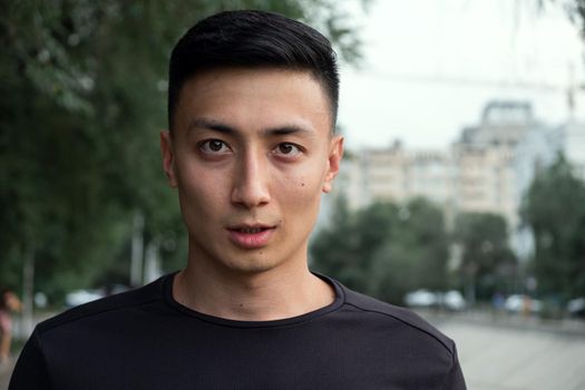 Shot of a handsome young man taking a moment to catch his breath after a morning run in the city