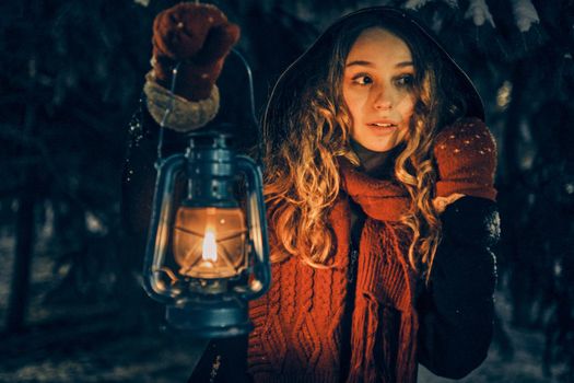 Young girl with lantern in winter forest fairy tale, book cover, christmas time