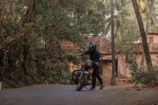 A Man On Motorcycle On Road in GOA village