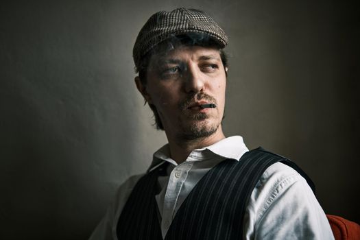 Young guy smoke cigarette, blows smoke, dressed in a retro style, in a beret, cinematic shot, big closeup