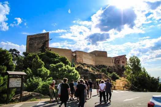 Novelda, Alicante, Spain- Group of tourist visiting the castle of La Mola in Novelda in a sunny day of September