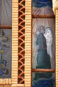 Novelda, Alicante, Spain- September 24, 2021: Guardian angel on stained glass in the Sanctuary of Santa Maria Magdalena on the top of the mountain in Novelda, Alicante, Spain.