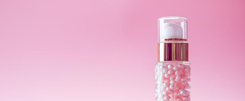 Skincare bottle on pink background, luxury beauty and cosmetic products.