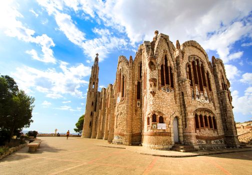 Novelda, Alicante, Spain- September 24, 2021: Details, archs, tower and pictures of Sanctuary of Santa Maria Magdalena on the top of the mountain in Novelda, Alicante, Spain.