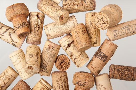 Tashkent, Uzbekistan - March 19, 2008 : Heap of old wine corks on white background. Studio photography