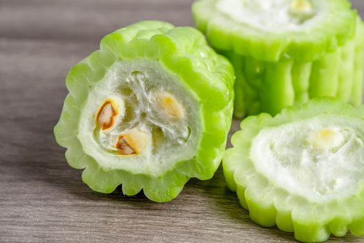 Chinese gourd vegetable for cooking healthy food on wooden background.