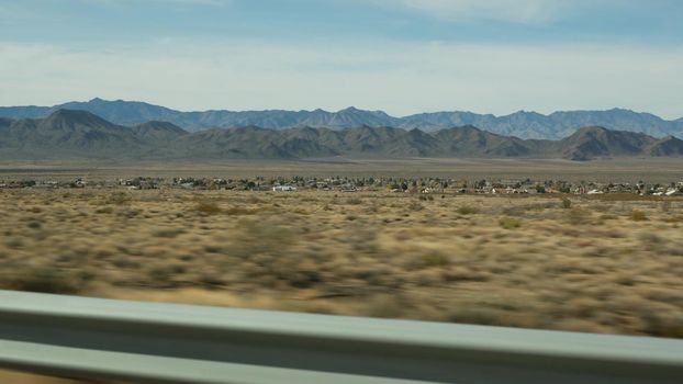 Road trip from Grand Canyon, Arizona USA. Driving auto, route to Las Vegas, Nevada. Hitchhiking traveling in America, local journey, wild west calm atmosphere, indian lands. Wilderness thru car window