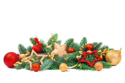 Christmas Border design element of fir tree branches and red and golden baubles and stars isolated on white background