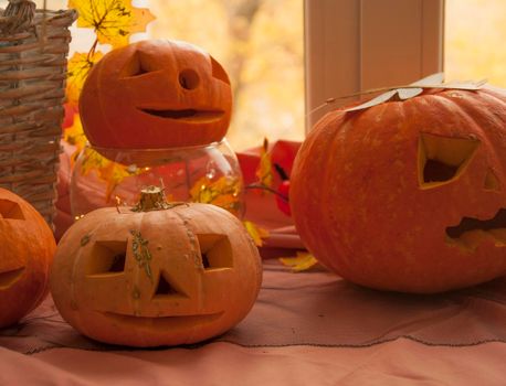 Happy halloween! Halloween pumpkin head jack lanterns. Carving pumpkin on the table at home.