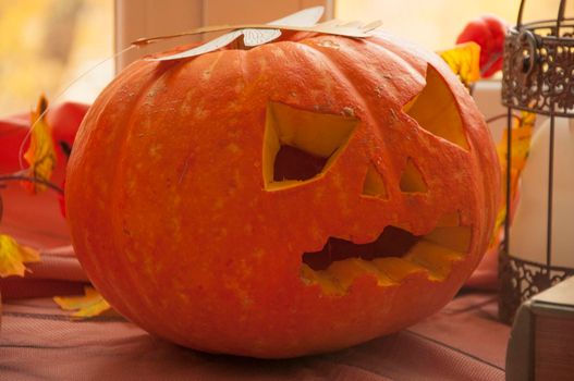 Happy halloween! Halloween pumpkin head jack lanterns. Carving pumpkin on the table at home.