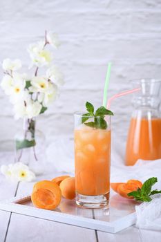 Refreshing, freshly cooked non-alcoholic cocktail made from apricot juice and mint 
