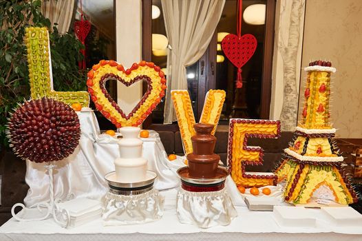 Black and white chocolate fountains on the table at the restaurant celebrating love happiness delicious eating dessert sweet.