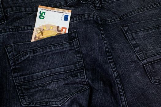 50 euros that come out of the pocket of black jeans